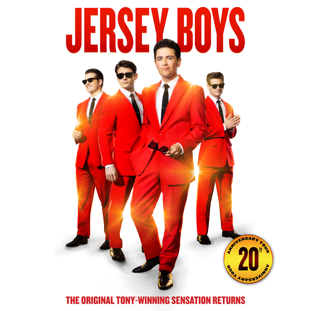 Jersey Boys musical cast in red suits, celebrating 20th anniversary tour.